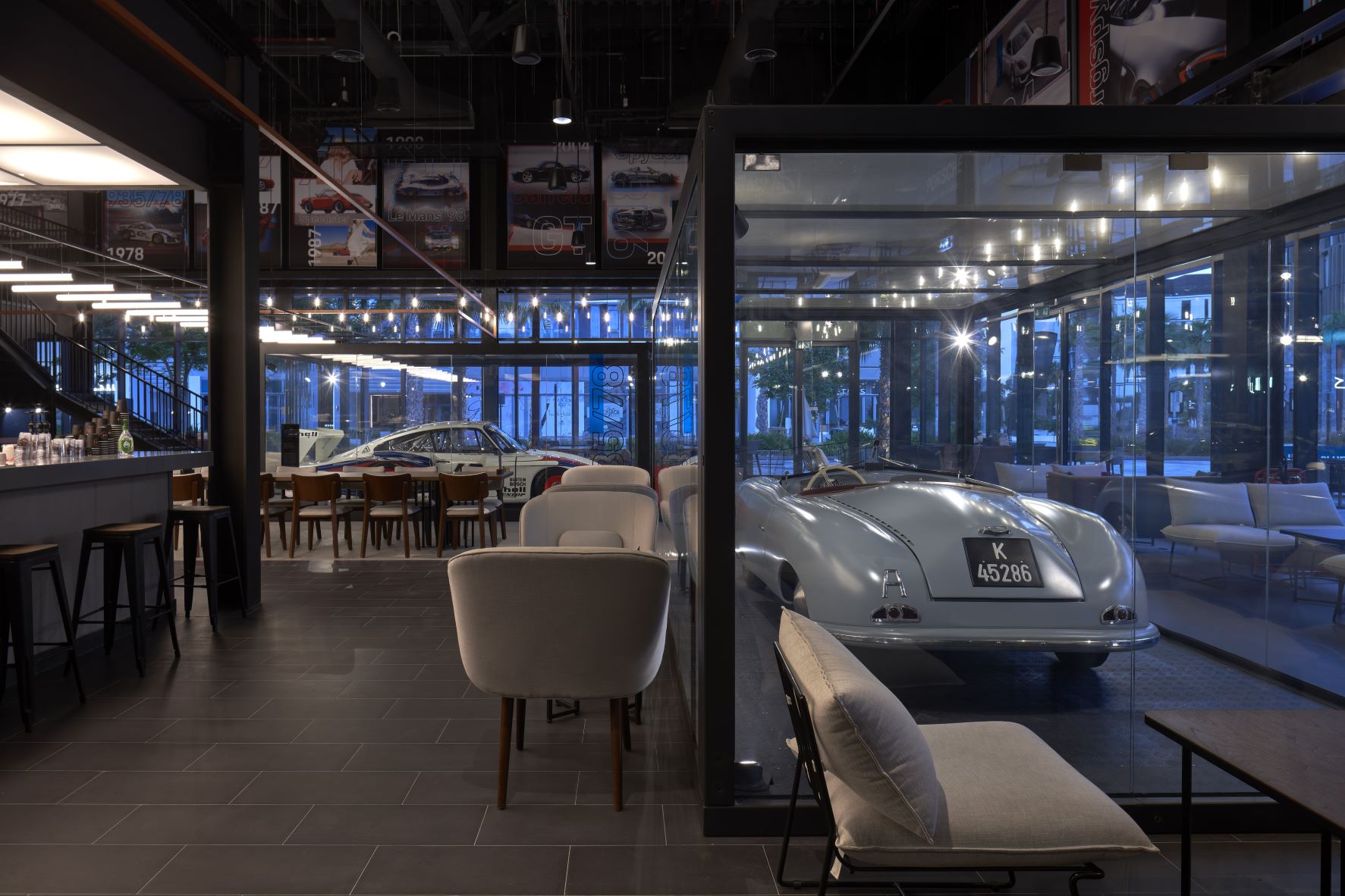 Design of DRVN car cafe saw Studio EM elevating 1,500kg luxury motors